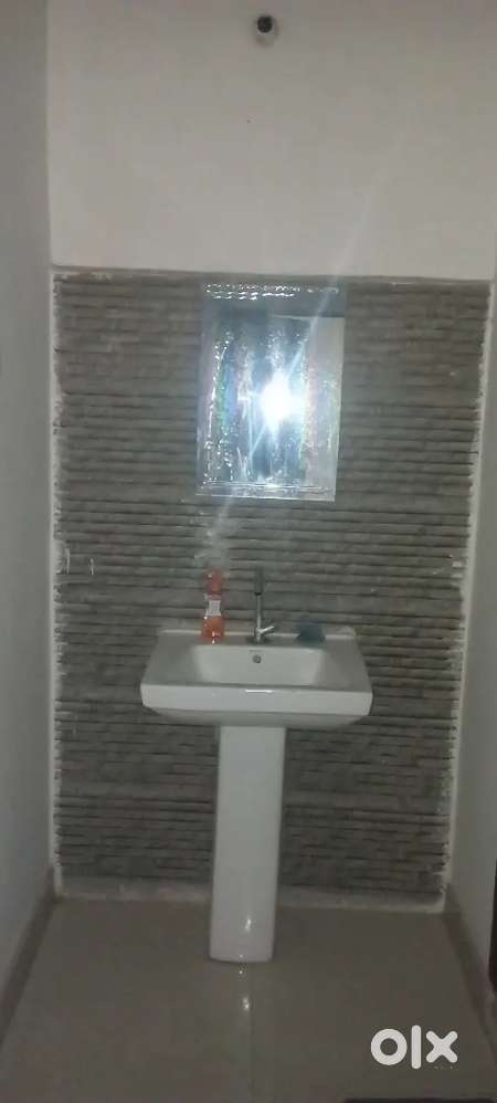 fully furnished room with attached kitchen