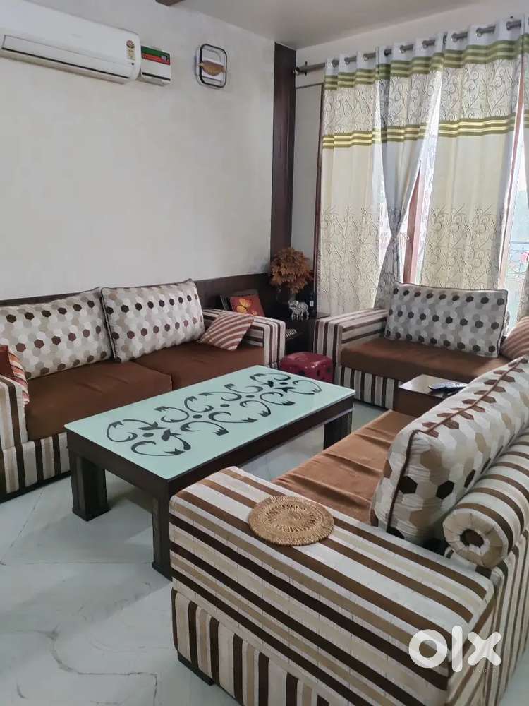 7 seater sofa set and a 2 seater settie with cushions
