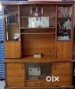Spacious wooden showcase with glass panels in good condition