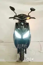 Boy /Girl At Electric Two Wheeler Scooter Showroom