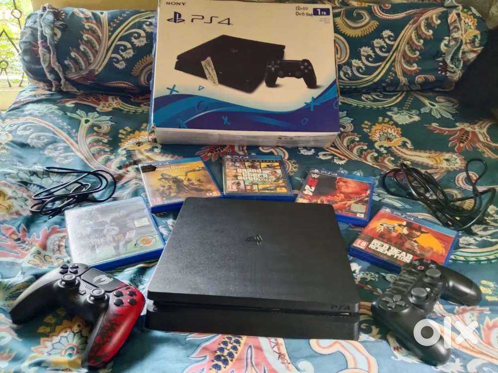 PS4 Slim 1TB with 2 controller & 5 games (EXcellent / working perfect)