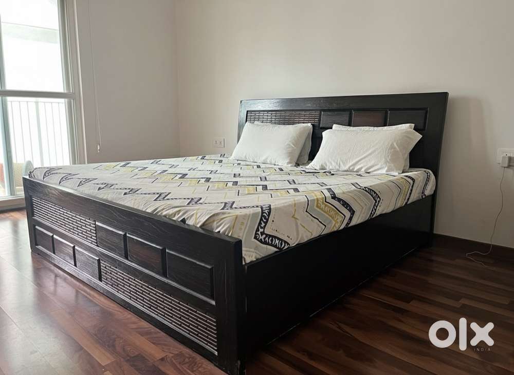 Dark Brown Wooden King Sized Bed