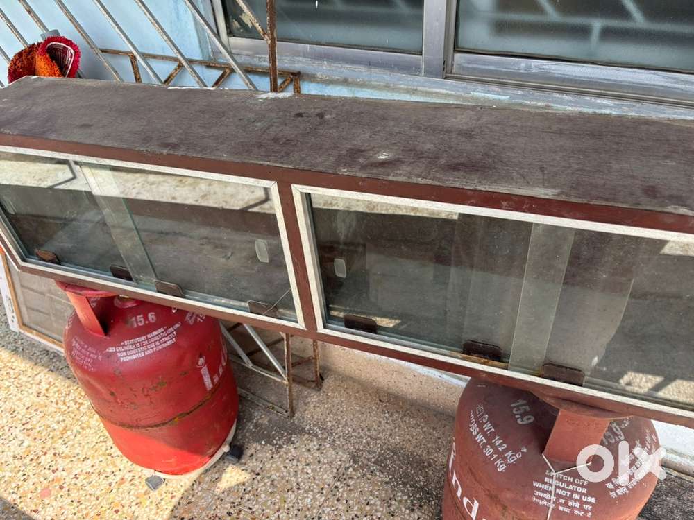 Ply showcase with glass shutters