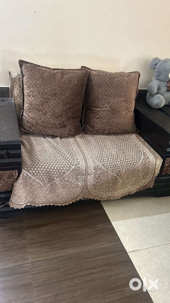 Heavy wooden 7 seater sofa set with table
