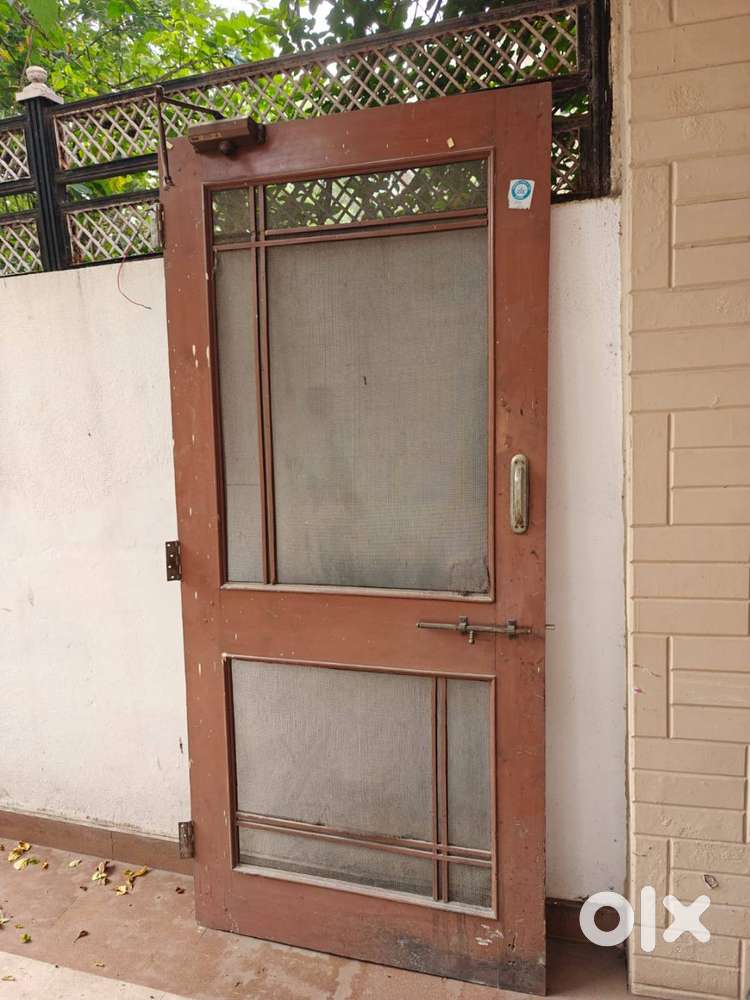Teak wood door with mosquito netting