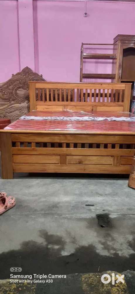 Well furnished wooden bed