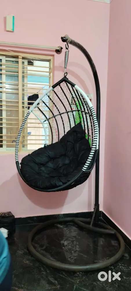 Single seater swing chair with stand.