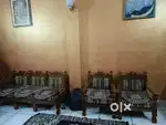 A wooden sofa set