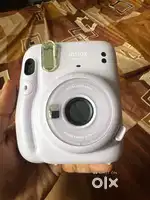 Instax fuji film mini 11 with blue poach and 8 films and frames