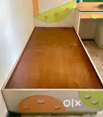 Two single bed with storage one attached table with glass one cabinet