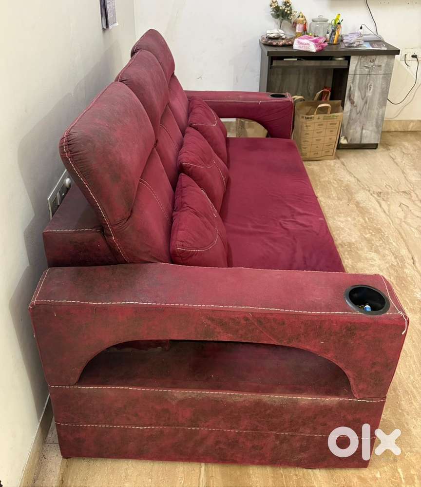 3 seater Sofa cum Bed Red in colour + Table