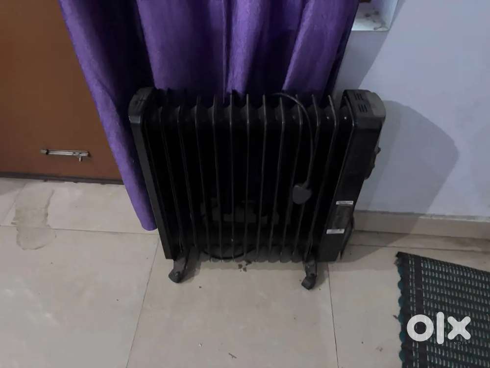 ELCTRIC OIL ROOM HEATER OF HAVELLS MAKE AND TWO  BLOWERS OF BAJAJ MAKE