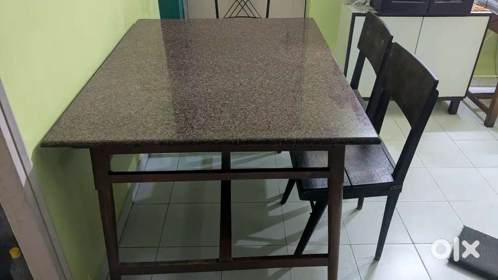 Marble top dinning table with two wooden chairs