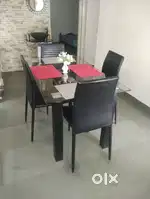 4 seater glass top dinner table