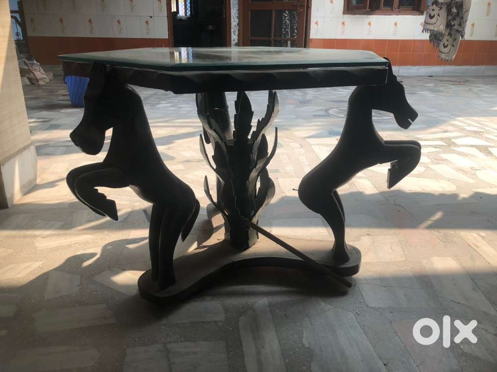 Wooden Table with Glass Surface.