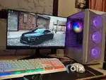 Desktop with gaming keyboard and mouse one year old.