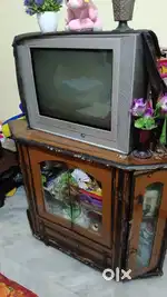 Sansung plano television with wooden trolley