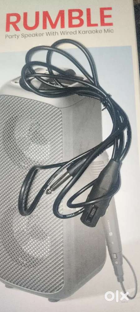Party speaker with wired karaoke mic