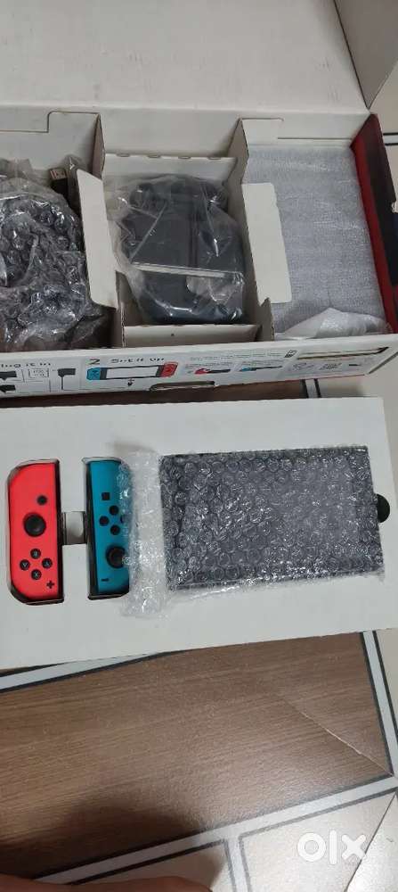 Nintendo swich v2 verry good condion pis 256 gb card 26 game lod k box