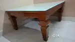 Wooden centre table with glass top