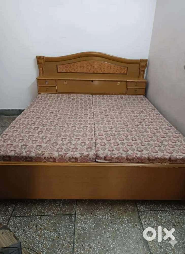 A double box bed with almost new mattress