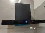 Faber chimney with remote and auto cleaning feature