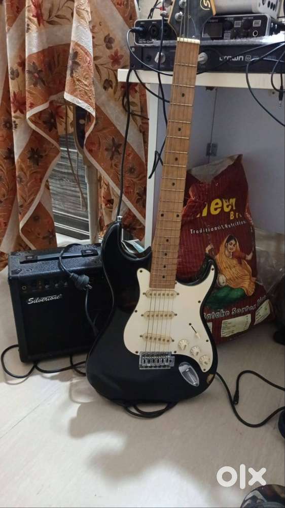 Electric guitar with amplifier