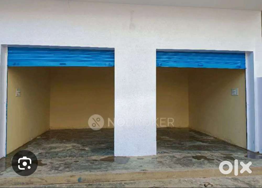 2 shops with divider in road corner