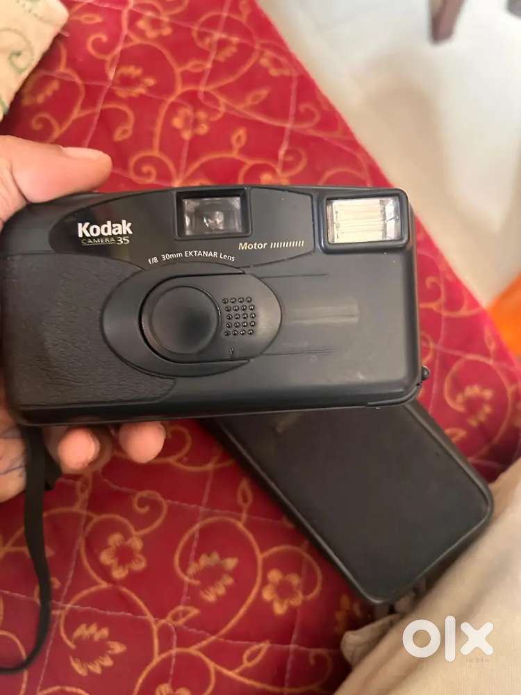 Vintage camera ,Jio set top box and digital camera