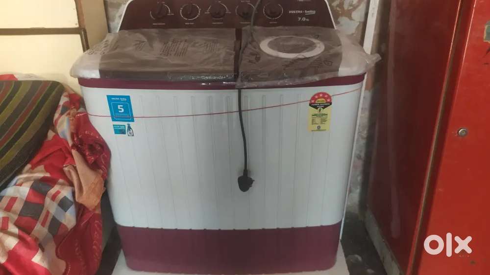 washing machine new brand voltas company 7 kg urjent sell