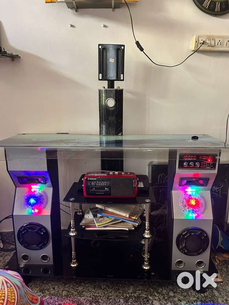 Glass tv unit with music system