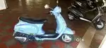 Vespa Lx 125 cc MH passing lady driven lady use