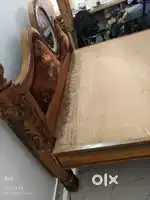 Big centre table, wooden cot, corner cushion sofa