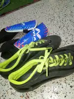 Football shoes and knee protector pair