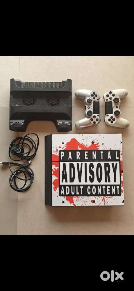 PS4 1TB with 2 remotes and charging dock