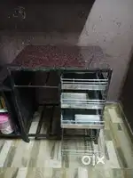 Iron table with granite top, and red iron rack