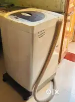 Lg fully automatic machind 6.5 kg,with stand which has wheels and .