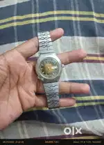 Watch of steel metal and brand name Ricoh