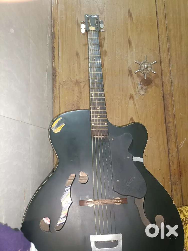 Givesone acoustic guitar