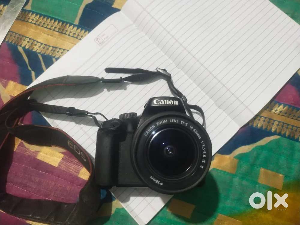 Canon EOS 1000D DSLR camera with an EF-S 18-55mm IS II lens.