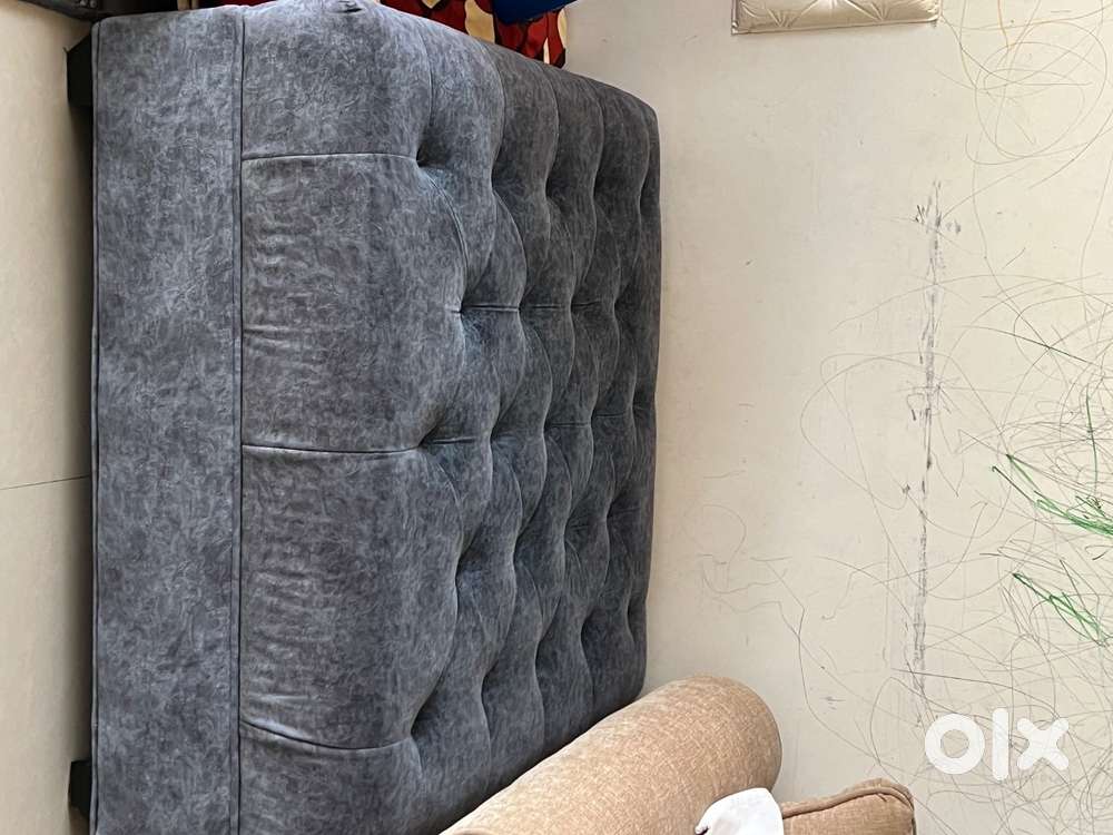 Gently used center table upholstered with glass top for sale