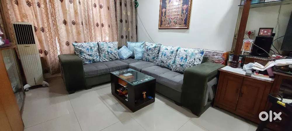 6 seater Sofa with 4 extra pouffe stools including centre table