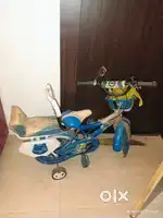 Kids bicycle and moon shape table along with four chairs