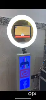 Instant photo booth with printer and roll