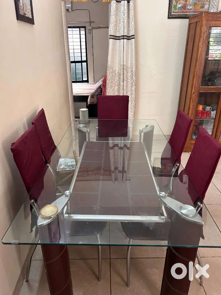 Glass dining table in dark maroon color ( 6 seater)