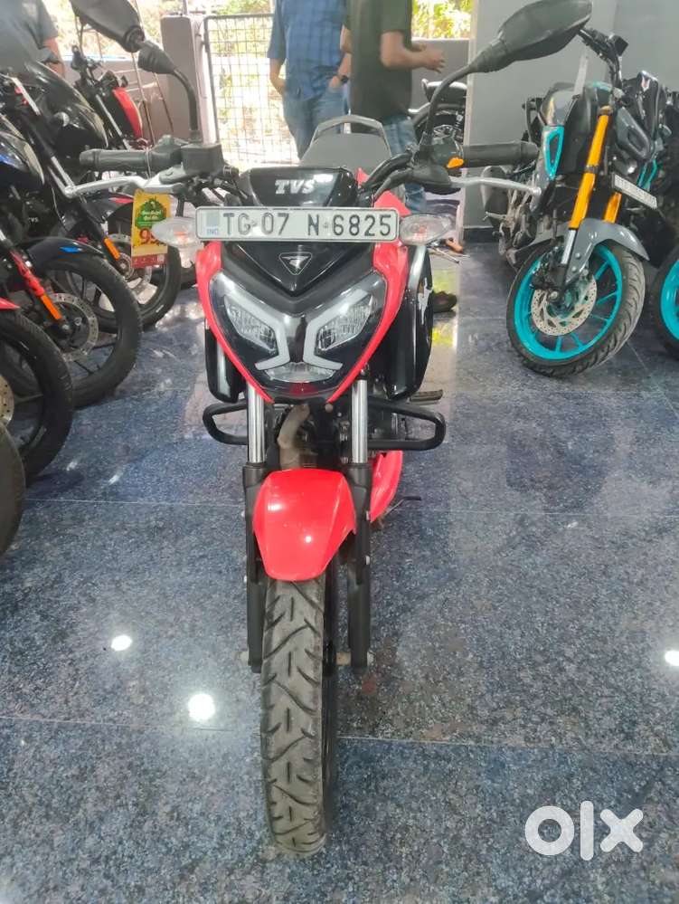 Single hand used TVS Raider 2024 model red colour in showrom condition