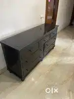 7 drawers long wooden cabinet with meatallic surface