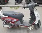 Pleasure red white scooty