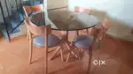 Wooden dining table with glass top in good condition, price negotiable