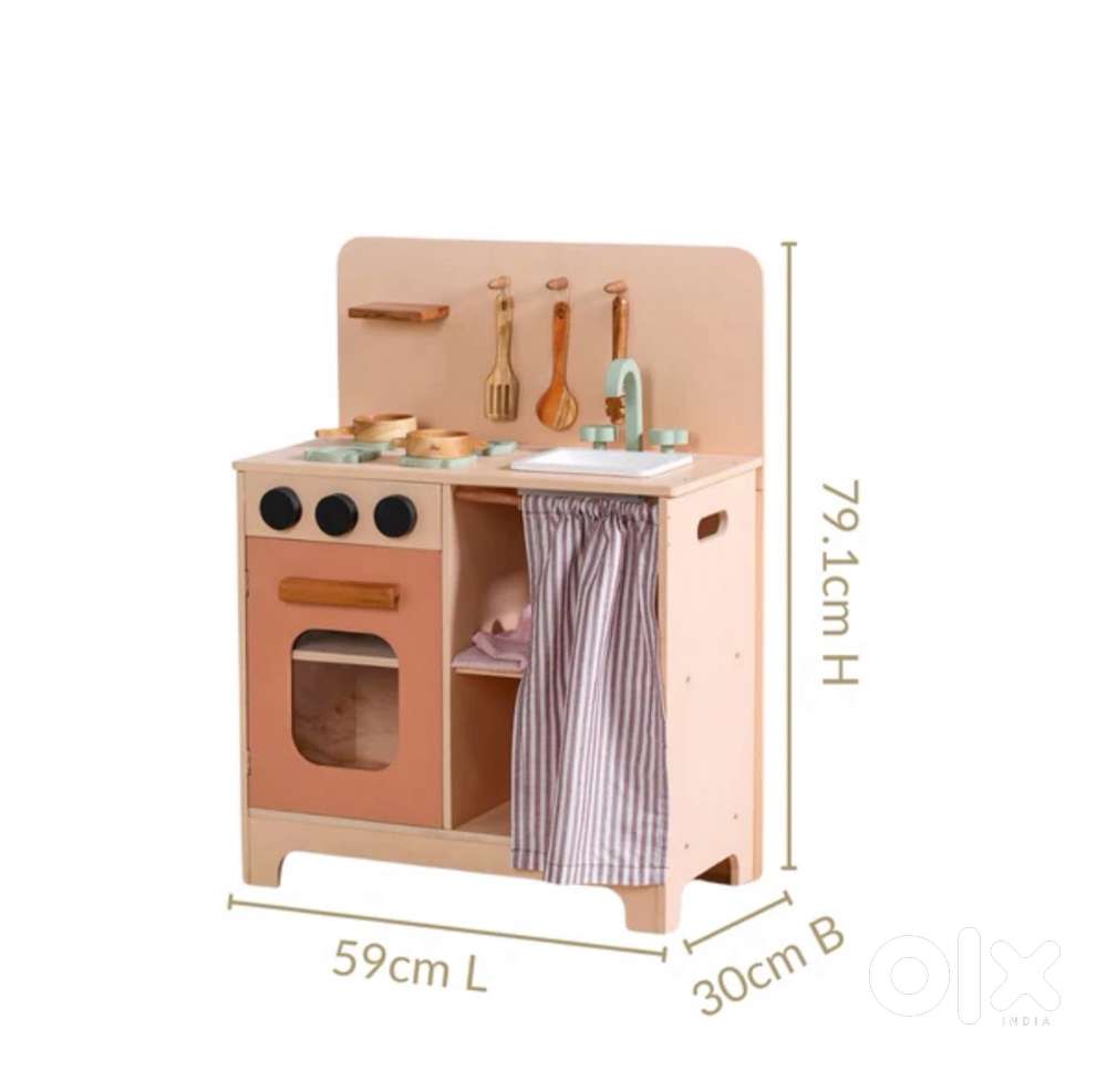 Wooden kitchen with play utensils